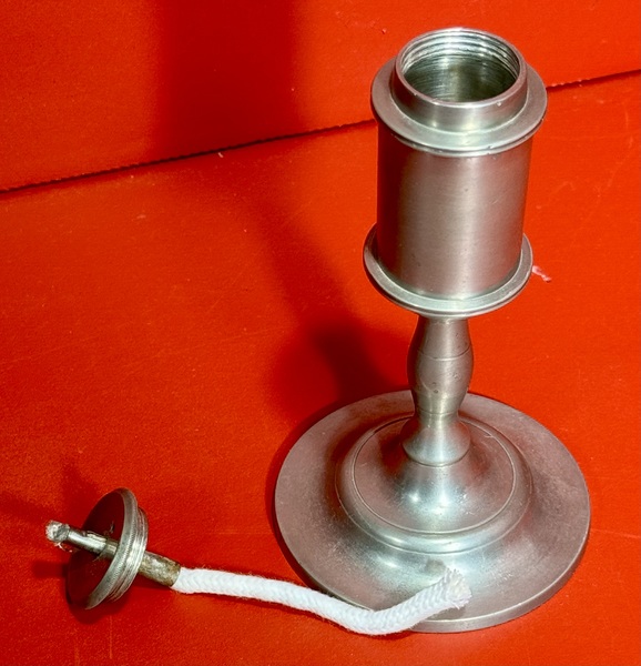 24-110. A small pewter whale oil lamp