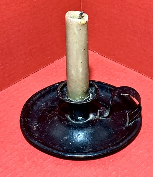 23-115. Early tin chamber stick