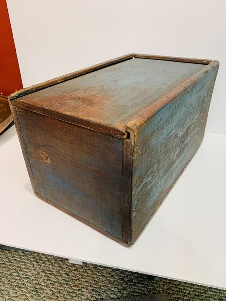 Slide lid storage box made of softwood.