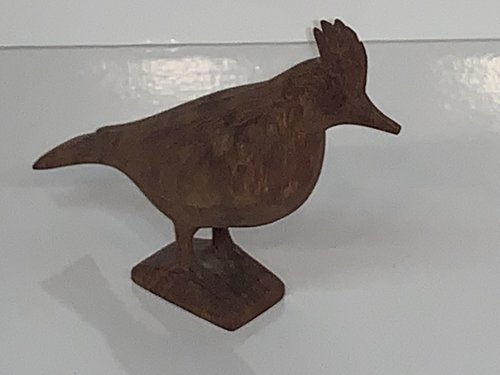 Carving of a Pileated woodpecker.