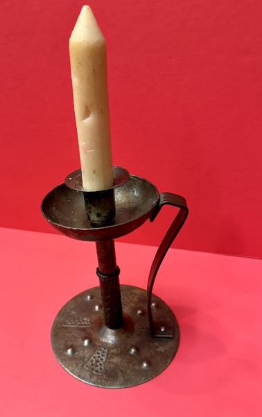 22-004. An Arts and Crafts sheet iron candlestick