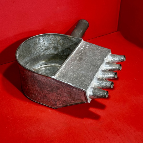 26-066. A Tin Candle Mold Wax-Filler