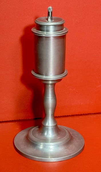 24-110. A small pewter whale oil lamp