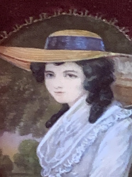22-029. Portrait miniature of a young woman.