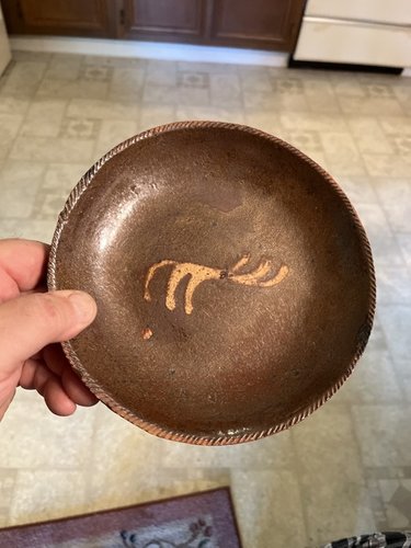 Early 19th century slip decorated pa. Eating dish