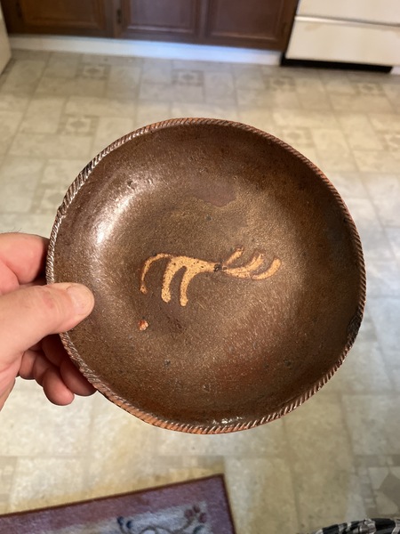 Early 19th century slip decorated pa. Eating dish