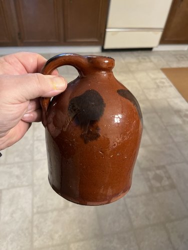 Early 19th century Red-ware jug with slip decorati