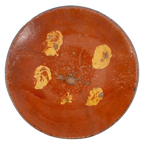 Slip decorated redware plate